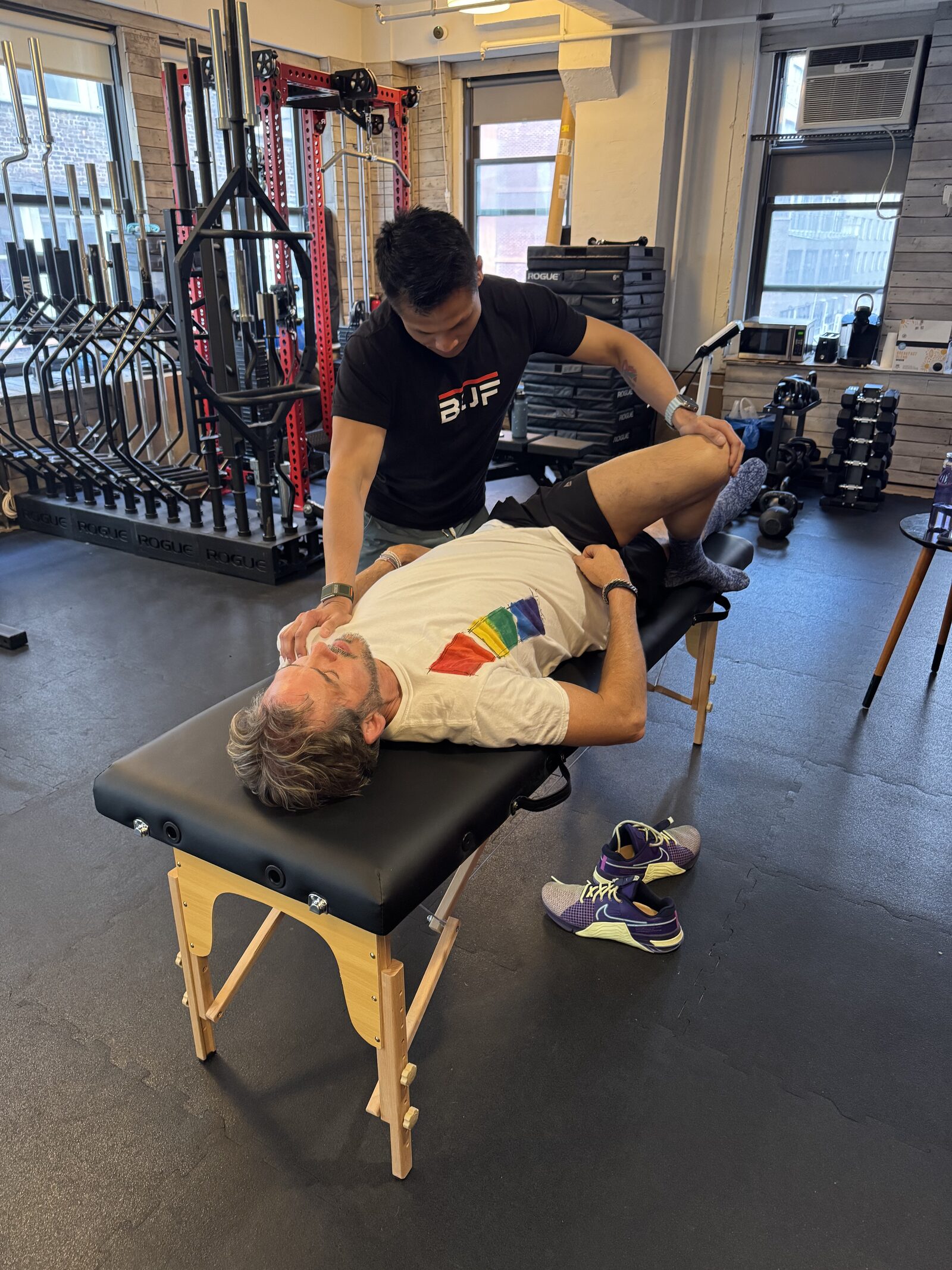 BUF trainer guiding a client through a mobility session in our Midtown Manhattan studio